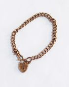 A 9ct gold curb link bracelet with padlock clasp, 7.6g approx.