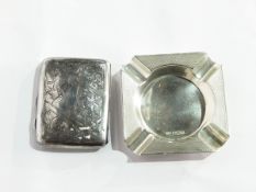 A silver engine-turned ashtray,