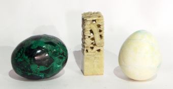 A quantity of hardstone eggs including malacite, oriental brass model fish,
