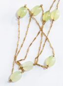 A 9ct gold faceted crystal style pendant on gold-coloured rope-twist chain,