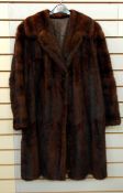A vintage musquash coat, a vintage fur coat labelled 