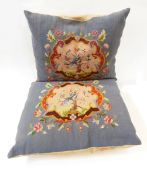 Two tapestry cushions having Bird of Paradise within scroll cartouche surrounded by flowers