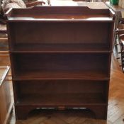 An oak three-tier open bookcase