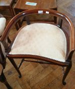 A late Victorian railback stool with shaped crest rail,