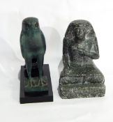A bronzed-effect model of a falcon,