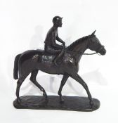A bronzed-effect model of a horse and jockey, the base inscribed 