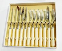 A plated jardiniere with a band of floral decoration and five assorted cased cutlery sets