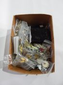 A quantity of costume jewellery, mainly brooches including a bakelite seagull brooch,