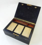 A leather travelling writing slope by Tyer & Woods, Broadway, Ealing, with recessed brass handle,