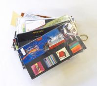 Approximately 50 GB presentation packs and GB card mint in three albums,