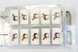 An album of cigarette cards including floral silks, Players 