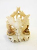 A marble desk stand modelled as a bird in flight, flanked by a recess for sand and ink,