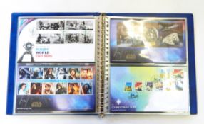 Two boxes of First Day Covers to include Royal stamp albums,