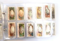 An album of cigarette cards including Players 