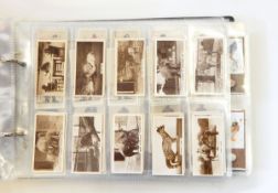 A brown album of cigarette cards including Wills 