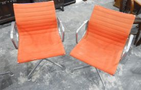 Set of six Eames open armchairs with orange upholstery,