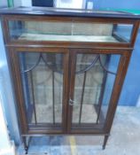 An Edwardian line inlaid mahogany dwarf display cabinet with vitrene top,