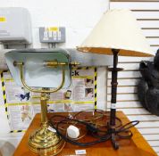 A desk lamp with green glass shade and two further decorative table lamps