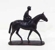 A bronzed-effect model of a horse and jockey, the base inscribed 