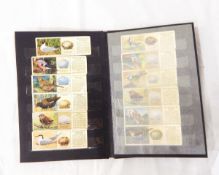 Four various albums and sundry leaves of cigarette cards and tea cards including Players 