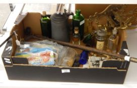 A riding crop with horn handle, a riding crop with a silver plated handle, glass bottles,