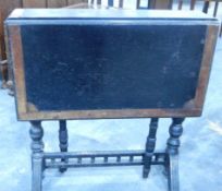 An Edwardian oak and cross banded Sutherland table on turned supports and with galleried stretcher,