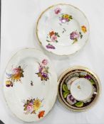 A 19th century Copelands china teacup and saucer decorated with flowers and foliage in bold colours