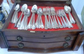 A Victorian inlaid mahogany serpentine fronted canteen with lift top over two drawers,