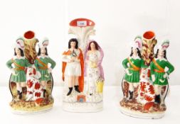 A pair of Staffordshire flatback ornaments depicting Highlanders and a Spaniel,