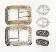 A pair of Victorian silver buckles of oval form with pierced engraved decoration,