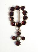 Victorian garnet brooch set ten circular facet cut stones and having garnet and pearl pendant