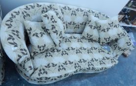 A Wesley Barrel mahogany framed three-seat settee with loose squab cushions and rolls