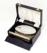 A silver backed brush of engine-turned design and a matching comb