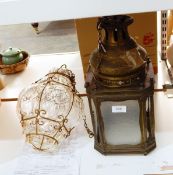 A glazed bulbous and brass light fitting and a brass light fitting with mottled glazed edges