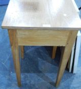 A pair of oak lamp tables each fitted a frieze drawer