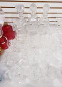A quantity of cut glassware to include stemware, brandy balloon, pair square decanters,