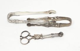 A pair of Georgian silver sugar tongs with pierced decoration,