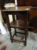 A small oak side table with undershelf,