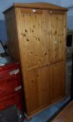 A pine two-door wardrobe,