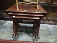 A mahogany nest of tables