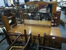An oak dressing table with three short drawers and mirror to back,