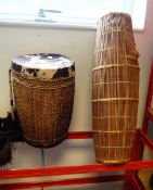 A large African skin bell-shaped drum,