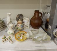 A Belleek vase of bulbous form, decorated with clover leaves,