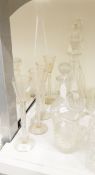 A set of four glasses with tall air-twist stems,