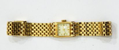 A lady's gold-coloured bracelet watch with integral brick link bracelet, marked 14K,