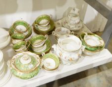 A Victorian part tea and coffee set, the green ground decorated with gilt,