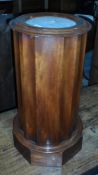 A mahogany circular cabinet with marbled top, enclosed shelf (the top has broken off),