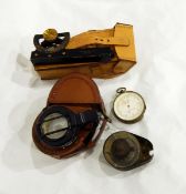 Sturman Nairobi pocket brass and blackened metal level in leather carrying case, a Bryson Optician,