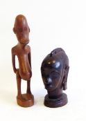 A carved African hardwood bust of woman's head, on circular base, probably ebony, 13.