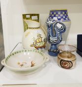 A Poole pottery vase decorated with blue geometric collar,